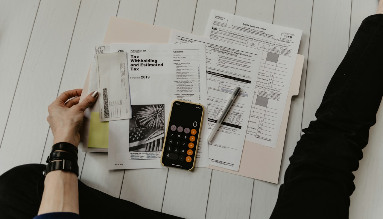 Calculator and financial documents used to model transition scenarios
